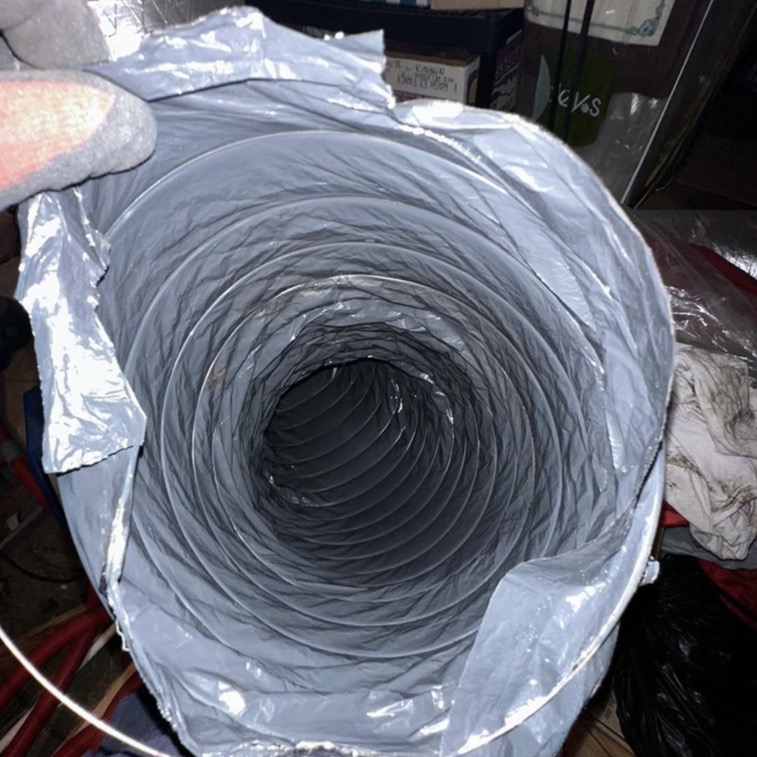 Air duct cleaning inspection photo showing dust and buildup
